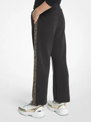 Pantalon de survêtement en jersey extensible avec bande à logos métallisée